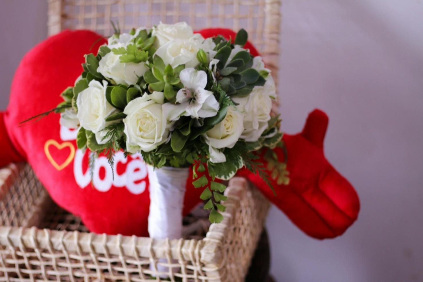 Wedding reception table arrangement with floral centrepieces